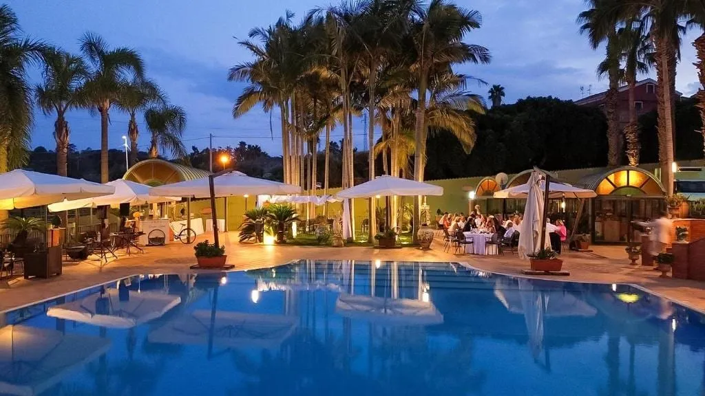 The pool in the evening with parasols