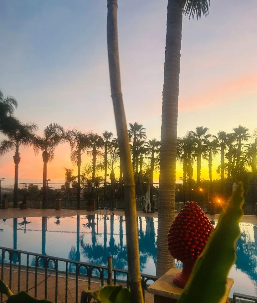 Sunset over the pool with a Sicilian ceramic pigna
