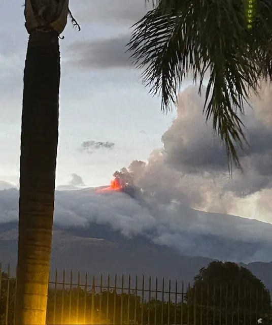 Mount Etna erupting at dusk, seen from the villa