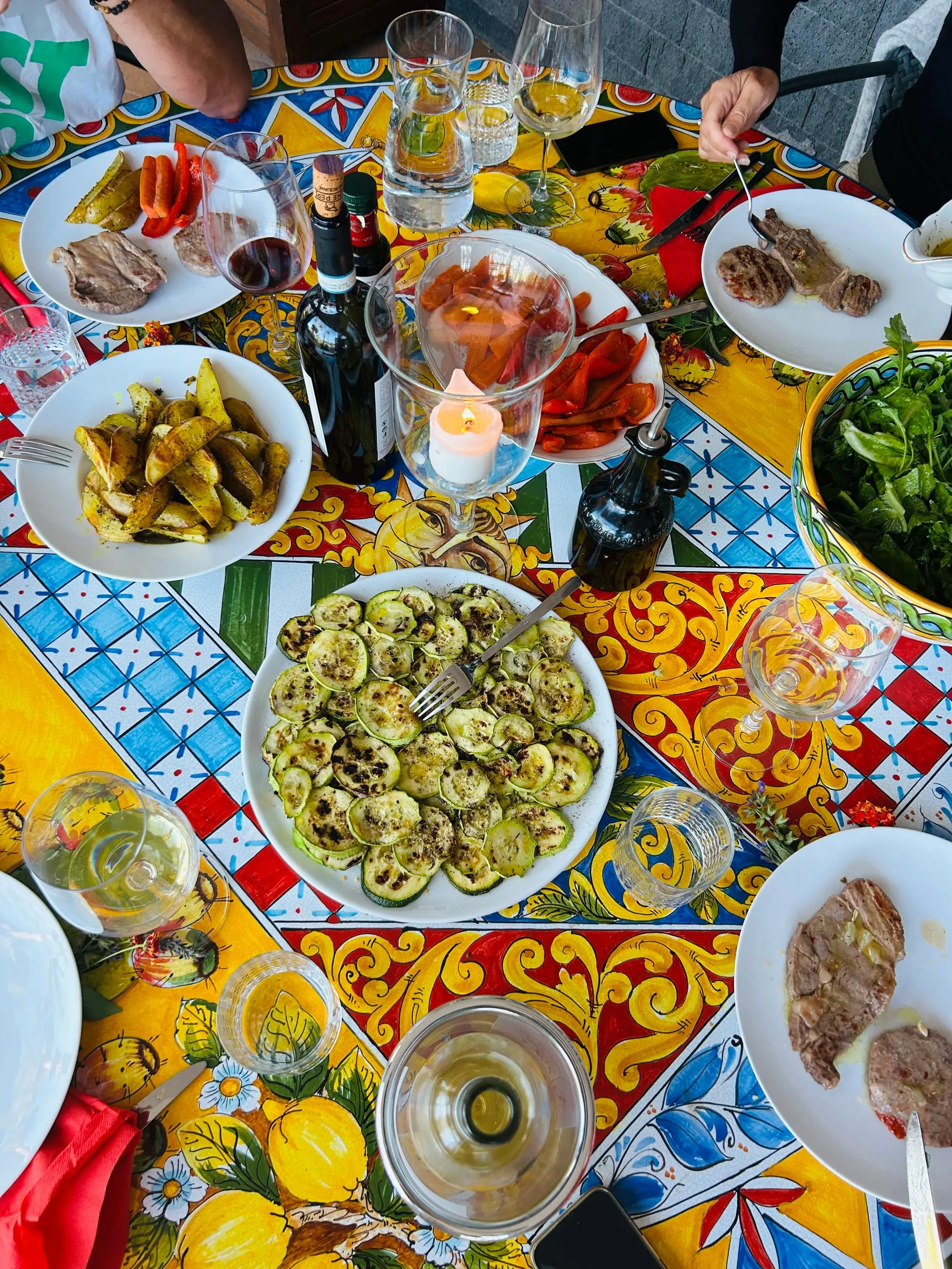 Spread of Sicilian dishes on the majolica table